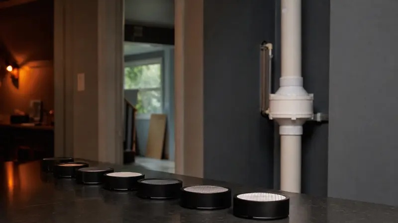Radon test devices lined up on a lab-style table